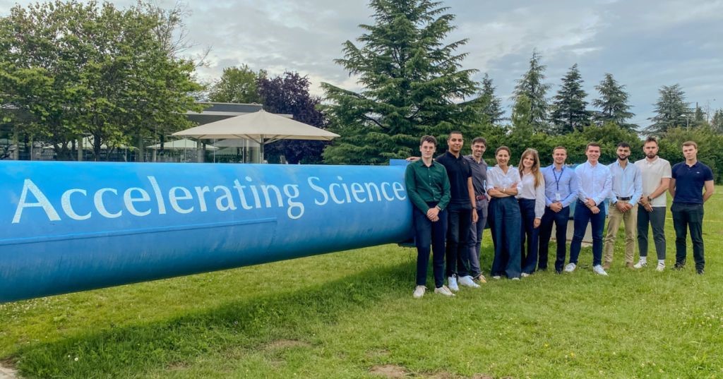 ESTP students standing infront of the R1 magnet